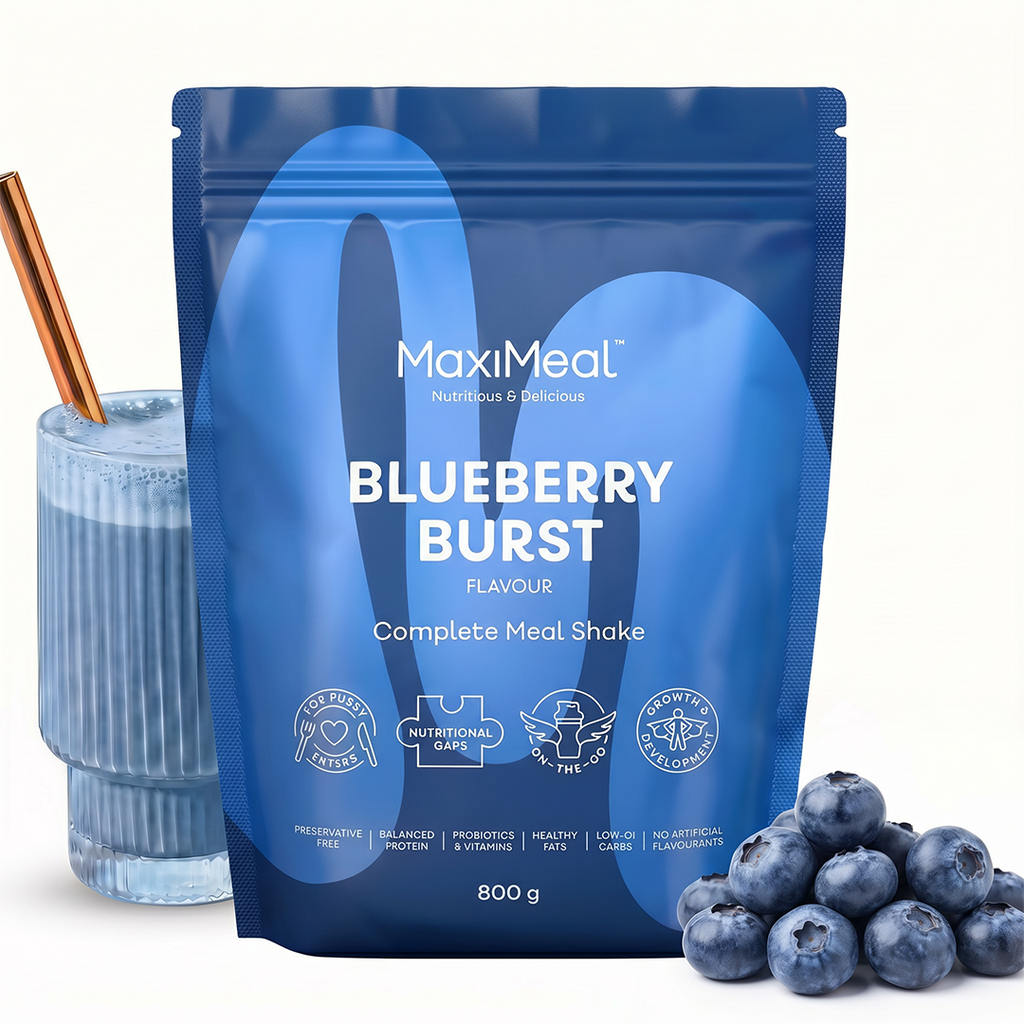 MaxiMeal Blueberry Burst complete meal shake 800g pouch styled with a blue-tinted shake in a ribbed glass and fresh blueberries, showing the flavour profile and ready-to-drink result, non-GMO, maltodextrin free, no artificial sweeteners, preservative free with balanced protein, probiotics, vitamins, healthy fats, low GI, and no artificial flavourings.