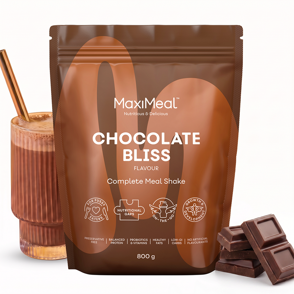 MaxiMeal Chocolate Bliss complete meal shake 800g pouch styled with a rich chocolate shake in a ribbed glass and dark chocolate pieces, showing the flavour profile and ready-to-drink result, non-GMO, maltodextrin free, no artificial sweeteners, preservative free with balanced protein, probiotics, vitamins, he